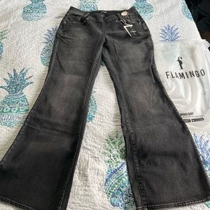 Flamingo , Vintage Button/zip side design, mid waist, flare jeans, black denim.